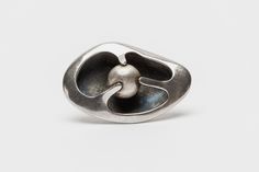 "Modernist Pin, c. 1960 by Sigi Piñeda (b. 1929) Taxco, Mexico sterling silver  1 7/8\" long x 1 1/8\" wide x 1/4\" deep Now in his 90's, Sigi Piñeda may be one of the last of the great historic artisans of Taxco still producing jewelry and new designs. He developed his own style in the early 1950's, approaching a more international flavor to his work than his contemporaries and predecessors who were exploring symbolic Mexican themes. Sigi's version of organic modernism was inspirational in deve Art Vocabulary, Mexican Modernism, Contemporary Jewelry Rings, Movement Jewelry, Organic Modernism, Anodized Aluminum Jewelry, Aluminum Jewelry, Modernist Jewelry, Jewelry Fashion Trends