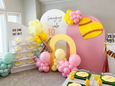 a baseball themed birthday party with balloons and decorations