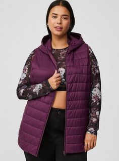 FIT Model is 5'8” wearing size 1. Measures 32” from shoulder (size 2). MATERIALS + CARE Cotton-blend fabric. . 100% nylon. Machine wash cold. . Imported. DETAILS Collared neckline. . Sleeveless. . Zip front. . The best plus size women's light packable puffer vest vests in winter bloom made of nylon. Torrid is your destination for cozy fall and winter clothes to keep you warm and comfortable. Vest Puffer Outfit Ideas, Winter Puffer Vest, Black Dating, Casual Outerwear, Casual Vest, Perfect Date, Long Torso, Puffer Vest, Cozy Fall