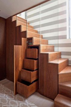 the stairs are made of wood and have drawers under them on each side for storage