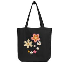 a black tote bag with flowers on it