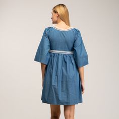 Boho-chic style with a modern accent. This denim mini dress features a spectacular embroidery detail in the chest, as well as romantic oversize french sleeves  and tassels to add more charm to this beautiful dress. Got any cowboy boots? It will be the perfect match! 100% Cotton. Wash Machine  30º ,  Press Medium  Temperature, Do  not  use spin-dry, Do not Bleach Spring Cotton Embroidered Mini Dress, Cotton Day Dresses With Embroidered Hem, Embroidered Mini Dress For Daywear, Cotton Daywear Dresses With Embroidered Hem, Cotton Dress With Embroidered Hem For Daywear, Spring Embroidered Relaxed Fit Dress, Cotton Mini Dress With Embroidered Hem, Spring Cotton Dress With Embroidered Sleeves, Spring Cotton Embroidered Dress With Embroidered Sleeves