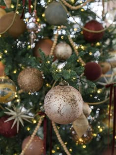 a christmas tree with ornaments hanging from it