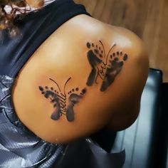 a woman's back with two footprints on it