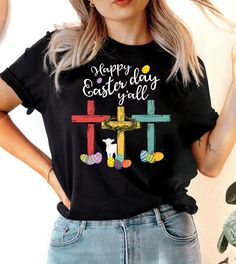 This "Happy Easter Y'all" design is the perfect tee to help you celebrate Easter! Black Top With Funny Text For Spring, Spring Black Top With Funny Text, Black Spring Top With Funny Text, Black T-shirt With Funny Text For Spring, Easter T-shirt With Letter Print And Short Sleeves, Easter Letter Print Short Sleeve T-shirt, Easter Graphic Print Crew Neck Top, Cross T Shirt, Ugly Christmas Sweater Couples