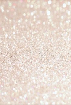 a close up view of glitter on a white background