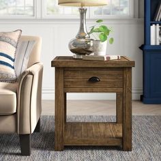 a living room scene with focus on the end table and chair, which has a lamp on it