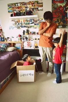 a man standing next to a child in a bedroom