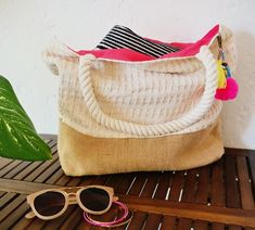 Mini Sayulita AlgodonOur famous Sayulita woven beach bag now in a smaller size. Made of natural burlap and a thick woven cotton canvas. It has a magnetic clasp for closure and an inner jute pocket for your phone and wallet. The handles are also made of cotton and are super soft, making it comfortable to carry around while exploring a seaside town or a cute little market somewhere sunny.If you're planning a beach bachelorette party the Sayulitas are the perfect bridesmaid tote bags, each pom pom Bohemian Cream Beach Bag For Beach Season, White Bohemian Jute Beach Bag, White Handmade Beachy Bag, Oversized Beach Bags, Personalized Tote Bags Bridesmaids, Woven Beach Bag, Woven Beach Bags, Beach Bachelorette Party, Pom Pom Charm