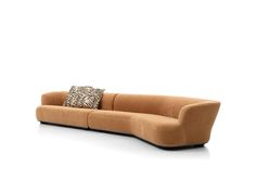 a brown couch with two pillows on it's back and the seat upholstered