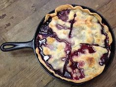 a pie is sitting in a cast iron skillet