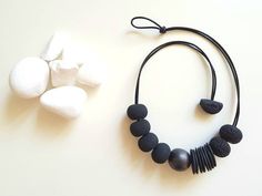 With every order you get a gift. Welcome!🤗 Modern necklace. Necklace that you can wear with jeans or as an elegant evening necklace... Very comfortable to wear. Color: black  Length  cord 55 cm. Dimension beads approx 25mm. Polymer clay and one wooden bead. Made when ordered. Polymer clay is a relatively new material. For jewelry made of polymer clay, do not act like it's metal or wood jewelry. Clay is durable and elastic but, of course, can break. It's advisable to keep the jewelry in original boxes. You can clean it with wet or dry soft cloth. Note: Do not spray perfumes or other cosmetic products on jewelry. That can lead to permanent damage.  If you have any question about this item don't hesitate and contact me. All items from JUST SU arrive nicely packaged in a box and bubble mailer Handmade Black Jewelry For Everyday, Handmade Black Everyday Jewelry, Black Handmade Jewelry For Everyday, Handmade Black Beaded Necklaces For Everyday, Adjustable Black Jewelry With Wooden Beads, Black Adjustable Necklace With Round Beads, Adjustable Black Necklace With Round Beads, Adjustable Black Beads Necklaces For Everyday, Minimalist Black Necklaces For Jewelry Making