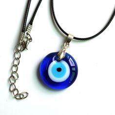 The Evil Eye concept dates back thousands of years, being wildly spread through the Mediterranean Region and the Middle East. It is believed that one can be harmed by the evil eye stare of an envious person, or by the lengthy praise. This can occur either consciously or unconsciously. The desire-oriented waves generated in a person about another individual are transmitted to that individual and an evil eye is cast on them. In Europe, it is believed that envious or malicious looks can bring bad l Blue Evil Eye Jewelry For Meditation, Blue Amulet Necklace For Good Luck, Blue Symbolic Evil Eye Jewelry, Handmade Symbolic Blue Necklaces, Handmade Blue Symbolic Necklace, Handmade Symbolic Blue Necklace, Spiritual Blue Evil Eye Jewelry, Teal Eyes, Eye Pendant Necklace