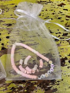 some beads are in a clear bag on a table