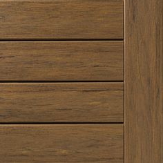 a close up view of the wood grains on this cabinet door, which has been painted dark brown