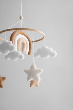 a mobile with stars and clouds hanging from it