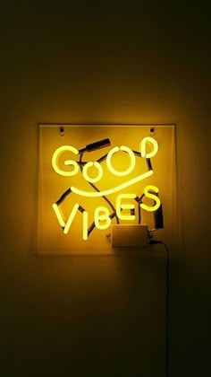 a neon sign that says good vibes on it