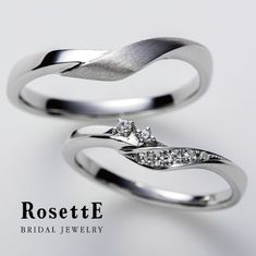 two white gold wedding rings with diamonds on each one and the words rosette bridal jewelry