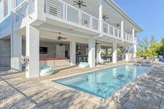 a large white house with a swimming pool