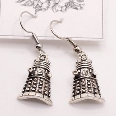 Handmade Earrings Style: Small Dalek Earrings Comes With Organza Bag New Makes A Great Gift For Any Occasion Or Holiday! Don't Forget To Check Out My Other Styles! Keywords: Doctor Who, Tardis, Dalek, British, Bbc, Dr Who, David Tennent, Present, Hanging, Earring, Drop, Birthday, Gift, Handmade, Made In Usa, Nj Artist, Female Owned, Artisan, Craft Doctor Who Jewelry, Doctor Who Dalek, Tanzanite Studs, Hanging Earring, Doctor Who Tardis, Safety Pin Earrings, Handmade Jewelry Earrings, Chanel Earrings, Large Hoop Earrings