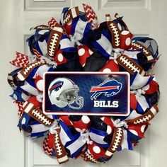 a wreath made out of footballs and red white and blue ribbons with the word titans on it