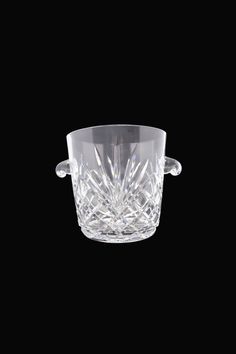 an empty crystal bowl on a black background