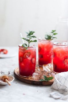 a watermelon and mint mojita is garnished with mint