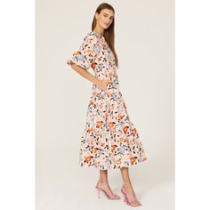 Blush floral cotton (100% Cotton). A-line. Crew neck. Short sleeves. Back button closure. 51.5" from shoulder to hemline. Imported. Spring Feminine Cotton Midi Dress, Feminine Cotton Midi Dress For Spring, Peach Floral Print Midi Dress, Spring Floral Cotton Midi Dress, Spring Cotton Midi Dress With Floral Print, Spring Cotton Midi Dress With Ruffle Hem, Spring Peach Midi Dress For Garden Party, Feminine A-line Floral Dress For Brunch, Peach Floral Print Short Sleeve Midi Dress