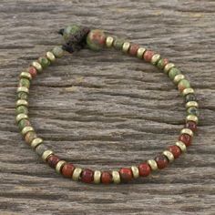 Thai artisan Tiraphan Hasub hand crafts this beautiful beaded earth tone bracelet with unakite red jasper and brass beads. A loop closure makes this bracelet adjustable. Jasper Bead Bracelet, Retro Bracelet, Hand Crafts, Jasper Bracelet, Wristband Bracelet, Brass Bracelet, Popular Jewelry, Handmade Wire Jewelry, Beaded Bracelets Diy