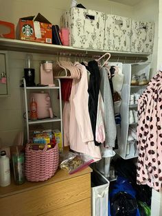 an organized closet with clothes and other items