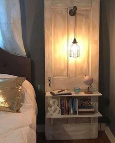 a bed room with a neatly made bed and a book shelf next to the door