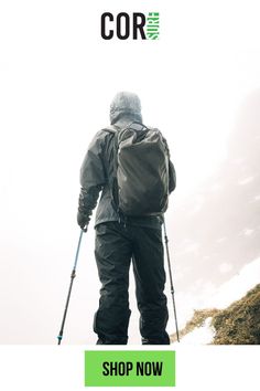 a man walking up a hill with skis on his back and the words cor written