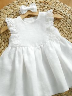 Gorgeous baby girl or toddler dress made of highest quality washed 100 % linen with ruffle lace. Perfect for your little one's baptism, flower girl, first birthday or other special occasion. Clothes made of linen has amazing properties: in the hottest time of the year - cools, in a cool - warms. It's natural, breathing and extremely cute looking! 🌿 Material: 100% linen, Oeko-Tex 100 certified. Lace : linen or cotton Colors: snow white, milk white, greyish sand 🌿 Please note. Each dress is uniq First Communion Spring Dress With Lace Trim, Summer Cotton Dresses With Delicate Lace, First Communion Lace Patchwork Dress For Spring, First Communion Spring Dress With Lace Patchwork, Spring First Communion Dress With Lace Patchwork, Lace Dress For First Communion In Summer, Elegant Spring Baptism Dress With Broderie Anglaise, Elegant Broderie Anglaise Baptism Dress For Spring, Elegant Summer Lace Dress For First Communion