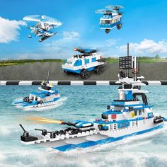 a lego boat is in the water with two smaller boats and one helicopter flying over it