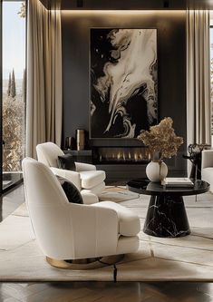 an elegant living room with black and white decor