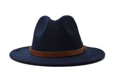 Type: Center Dent Wide Brim Fedora Adjustable Size: With a tie of a knot, adjust the fit of your hat to the ideal size from 21 ¼ to 23 ¼ inches. Dimensions: Wired Brim: 2 7/8", Crown: 4" Color: Navy Blue Materials: 65% Cotton , 35% Polyester Genuine Leather Band Map Jasper Stone Natural Reeves Venery Pheasant Feather Origin: All of our hats begin in Ecuador as the body is molded, then completed at our studio in Tucson, AZ. Here we shape, trim and handcraft all of the hatbands, leather goods, sti Adjustable Hats For Formal Occasions In Fall, Navy Adjustable Hat For Winter, Classic Navy Hat With Flat Brim, Adjustable Navy Winter Hat, Adjustable Blue Hat Bands For Fall, Navy Adjustable Winter Hat, Adjustable Solid Felt Hat With Flat Brim, Classic Navy Flat Brim Hat, Elegant Adjustable Flat Bill Hat