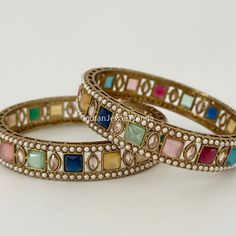 A Pair of Navratan Polki Stone bangles, Antique Dull gold bangles,Indian Kada bangles, Wedding Jewelry,Punjabi Jewelry, Bollywood bangles Made from High-Quality Hand Picked Kundan Stone Highest quality and craftsmanship Ready to ship from California in 1 business day. To measure the size of the bangle: Please refer to the size guide in the picture above. Don't hesitate to get in touch with us This is 100% Handmade jewelry. So Color, shades, and texture displayed may slightly vary from the actual product due to digital image limitations. We request you consider these minor variations. Please expect the possibility of some slight imperfections when buying handmade jewelry. If you have any questions, please message or email us. Arrives in a gift box. Thank you so much for visiting my shop Festive Bridal Bangle Sets With Stone Work, Gold Bollywood Bangle For Navratri, Multicolor Gota Work Bangle For Festivals, Festive Multicolor Bracelets With Gota Work, Festive Bridal Bangle Sets For Diwali, Elegant Multicolor Cutdana Bangle, Gold Bangle With Zari Work For Navratri, Gold Zari Work Bracelets For Navratri, Festive Multicolor Bangle With Zari Work