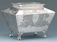 an ornate silver box with floral designs on it