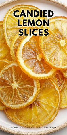 sliced lemons on a plate with the words candied lemon slices