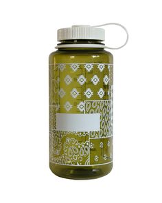 a green jar with a white label on it and a string attached to the lid