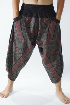 "Male Model Tall 5'9\" Waist 34\" Samurai Pants - elastic waistband and cuffs - Fits all! Unisex pants These beautiful casual pants is unique & comfortable to wear Handmade with a very lovely pattern, it is easy to wear and great for many occasions. One size fits most. These pants are great for many different activities like traveling, dancing, going to festivals, rock climbing, yoga, meditation, massage, working out, martial arts, Taichi MATERIAL: 100% Cotton APPROX MEASUREMENT: Waist: 24\" Harem Pants With Pockets For Festivals, Relaxed Fit Harem Pants For Festival, Stretch Harem Pants With Pockets For Festival, Stretch Harem Pants With Elastic Waistband For Festival, Festival Harem Pants With Elastic Waistband, Casual Pants With Elastic Waistband For Festivals, Wide Leg Pants With Elastic Waistband For Festivals, Casual Wide Leg Bottoms For Festivals, Black Harem Pants With Elastic Waistband For Festivals