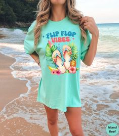 🏝️Discover our Flip Flop Vibes Comfort Colors summer beach vacation shirt!🏝️  This trendy Tropical flip flops t-shirt features an eye-catching graphic design that is sure to enhance your next beach vacation! Made of 100% ring-spun ethically grown cotton, this shirt is super soft and comfortable. It has a relaxed fit which is made of a medium fabric that is preshrunk. Looks super cute with shorts, jeans or as an oversized beach cover up. Great gift for a Beach Lover! Comes in 14 pretty colors! Tropical Shirt, Summer Tshirt, Beach Lover Gifts, Summer Beach Vacation, Summer Flip Flops, Tropical Shirts, Beach Lover, Comfort Wear, Summer Tee