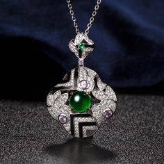 "Details * Handmade item * Material: 14K Solid White Gold .💯Center Stone： 1.59ct Natural emerald； .🎉Side stones 1 ：0.68ct Diamond .🎉Side stones 2 ：0.035ct Tsavorite .🎉Side stones 3 ：0.287ct Pink Sapphire I T ' S ∙ E X Q U I S I T E    * All personalization is done BY HAND. After calcination, dissolution, recombination, carving and grinding         of the complex process * Handcrafted with care and love by happy hands in my studio. * Each jewelry comes beautifully gift wrapped. Let me know if Elegant Hallmarked Green Emerald Necklace, Elegant Formal Cabochon Emerald Necklace, Elegant Formal Emerald Cabochon Necklace, Luxury Green Cabochon Necklace, Elegant Multi-stone Emerald Necklace For Formal Occasions, Elegant Multi-stone Emerald Jewelry, Exquisite Round Green Emerald Necklace, Elegant Formal Emerald Necklace With Intricate Design, Luxury Green Collectible Jewelry