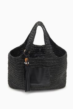 Our Kamari Tote is a refined, everyday bag made all the more elegant thanks to subtle detailing. Hand-woven from black raffia, it has a roomy interior that’s unlined to maintain its drapey silhouette and has two top handles you can easily slip over your shoulder. A whipstitched-trimmed leather pocket on the outside secures smaller items, while the leather tassel with antique brass ring adds an elevated touch. Composition: 100% Polypropene Pair with the Antilles Maillot to complete the look. Nyc Boutiques, What Women Want, Leather Pocket, Woven Tote Bag, Crochet Bags, Leather Tassel, Handbag Shoes, Everyday Bag, Ulla Johnson