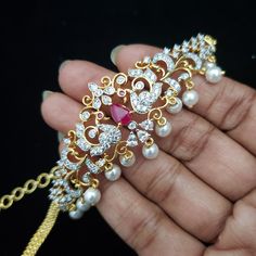 "'Bajuband' or Armlet (also known as Ananta, Angada), it is a type of bracelet worn on the upper part of the arm. Armlets create a style statement for women in present times. Besides being wedding jewelry, armlets are also fashion jewelry. Armlets are the aptest accessory for weddings, engagements, theme parties, and religious occasions. Dainty armlets look beautiful when worn with lehengas, saris, or any sleeveless traditional attire. Measurements: End to End length: 12\" (Main Armlet length 7\ Elegant Wedding Choker With Stone Work, Elegant Hand Set Tikka For Marriage, Adjustable Temple Jewelry Bracelets For Wedding, Elegant Festive Marriage Tikka, Adjustable Temple Jewelry Sets For Wedding, Adjustable Festive Jewelry Sets For Weddings, Ruby Wedding, Bangles Indian, Ruby Emerald