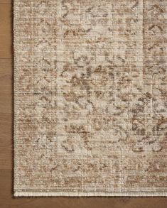 an area rug with brown and beige colors