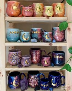 a shelf filled with lots of different colored mugs