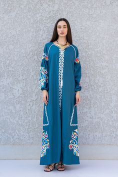 **Note : The kaftan in the video is a different color of the exact same Kaftan and is only displayed to show the fit, flow, and cut of the Kaftan. You will receive the one in the pictures.** This bohemian multicolour embroidery dress is a an eye catcher! It is an extremely comfortable wear, light and soft and can be used on many occasions -  home gatherings, festival parties, summer occasions, dinners, or just in your home to feel comfortable.  Fabric : 70% Egyptian Cotton; 30% Polyester. Kaftan Traditional Long Sleeve Maxi Dress With Multicolor Embroidery, Folk Style Embroidered Floor-length Dress, Bohemian Floor-length Dress With Embroidered Border, Summer Cotton Dresses With Dabka Detailing, Traditional Maxi Length Spring Abaya, Floral Embroidered Floor-length Maxi Dress For Eid, Floor-length Cotton Dress For Eid, Floor-length Maxi Dress With Floral Embroidery For Eid, Floor-length Floral Embroidered Maxi Dress For Eid