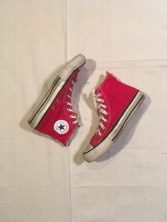 "vintage Converse Chuck Taylor hi top sneakers made in USA red canvas extra stitch rubber soles blue insole stamp good vintage condition, light wear light fade, marks, dirt one instep grommet gone left laces are 2 tied together at front size 6 (Men's), like a women's 7 1/2 measures, insole-9 3/4\" sole-10 1/4\" width-3 5/8\"" Retro Cotton Sneakers With Round Toe, Cotton Retro Sneakers With Round Toe, Vintage Red Mid-top Sneakers, Retro Cotton High-top Sneakers With Round Toe, Vintage High-top Sneakers With Rubber Toe Cap, Vintage Canvas Shoes With Rubber Toe Cap For Streetwear, Vintage Canvas Sneakers With Speckled Midsole, Vintage Red Sneakers With Vulcanized Sole, Retro Red High-top Sneakers