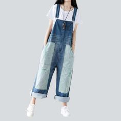 Introducing our 2023 Autumn Collection contrast color women's denim overalls ââ‚?a street style wardrobe staple that promises to make you the talk of the town!Why You'll Fall In LoveThis jumpsuit is the perfect amalgamation of modern fashion sensibilities and Y2K nostalgia. Crafted with love and care. it features a loose. baggy silhouette. intricate painted prints. and a sanded finish for a unique texture. Its vibrant color and delicate suspenders and buttons closure make for an eye-catching ens Casual Color Block Cotton Jeans, Cotton Straight Leg Overalls For Summer, Trendy Contrast Color Cotton Jeans, Blue Baggy Straight Leg Overalls, Baggy Blue Straight Leg Overalls, Casual Color Block Jeans For Spring, Casual Patchwork Jumpsuits And Rompers For Spring, Blue Overalls With Pockets For Fall, Spring Casual Color Block Jeans